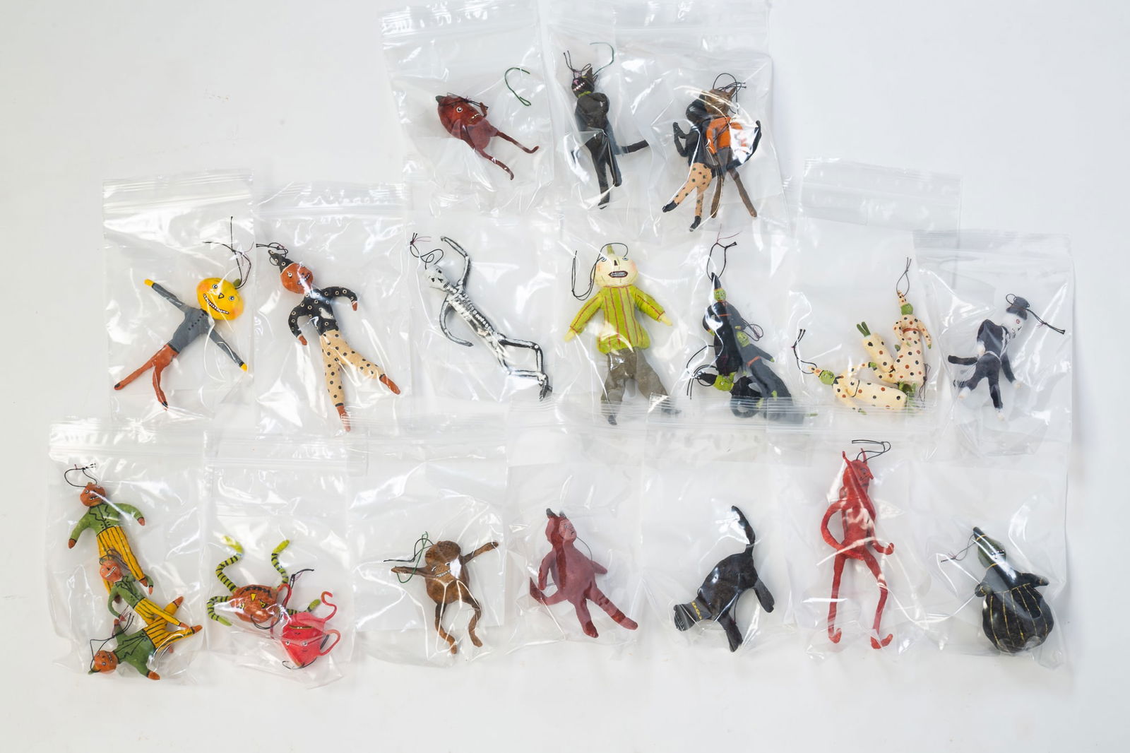 TWENTY-FIVE MARIA PAHLS (AMERICAN, CONTEMPORARY) PAINTED SPUN COTTON HALLOWEEN ORNAMENTS. (1 of 4)