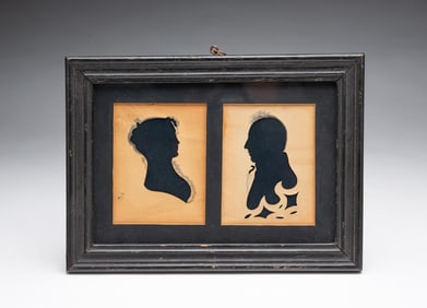 A PAIR OF EARLY HOLLOW-CUT AND INK WASH SILHOUETTE PORTRAITS.