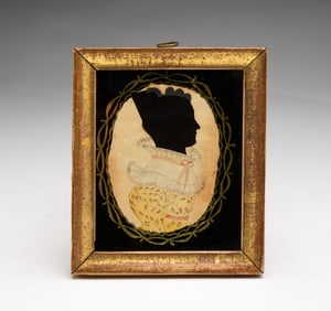 AMERICAN HOLLOW-CUT AND WATERCOLOR SILHOUETTE PORTRAIT OF A YOUNG WOMAN.