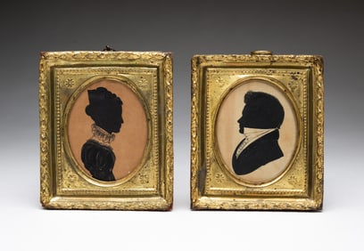 TWO AMERICAN HOLLOW-CUT AND GOUACHE SILHOUETTE PORTRAITS OF A LADY AND GENTLEMAN.