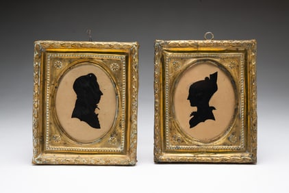 TWO AMERICAN HOLLOW-CUT AND GRAPHITE SILHOUETTE PORTRAITS OF A MAN AND WOMAN.