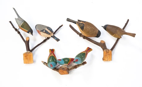 THREE AMERICAN FOLK ART CARVED AND PAINTED BIRDS-ON-BRANCHES HANGING SCULPTURES.