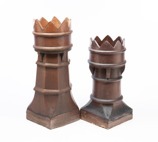 TWO ENGLISH BUFF CLAY CHIMNEY POTS.