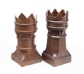 TWO ENGLISH BUFF CLAY CHIMNEY POTS.