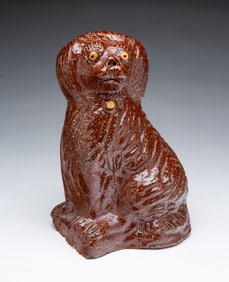 OHIO SEWER TILE SEATED SPANIEL, SIGNED "ROY BLIND".