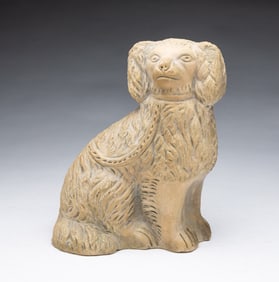 AMERICAN BUFF CLAY SEATED SPANIEL.