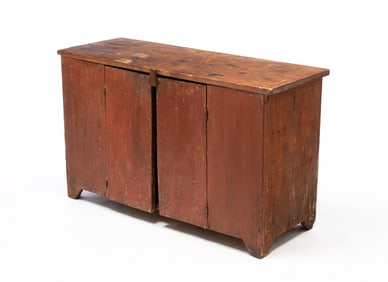 AMERICAN REDDISH-BROWN PAINTED PINE LOW KITCHEN CABINET.