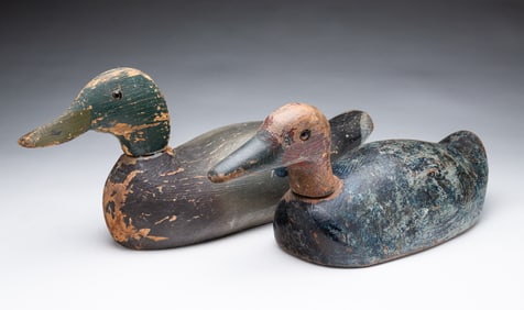 TWO AMERICAN FOLK ART CARVED AND PAINTED DUCK DECOYS.