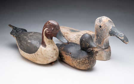 THREE AMERICAN FOLK ART CARVED AND PAINTED DUCK DECOYS.