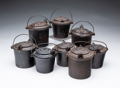 EIGHT DIMINUTIVE AMERICAN CAST IRON GLUE POTS.