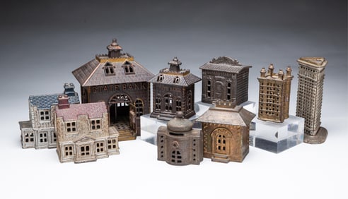 NINE AMERICAN CAST IRON ARCHITECTURAL STILL BANKS.