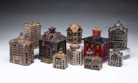 TEN AMERICAN CAST IRON ARCHITECTURAL STILL BANKS.