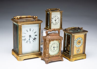 FOUR AMERICAN BRASS CARRIAGE CLOCKS.