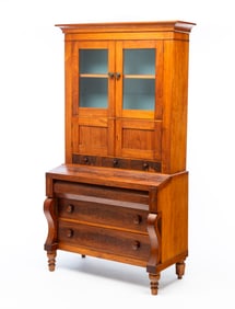 AMERICAN EMPIRE WALNUT AND MAHOGANY SECRETARY BOOKCASE.