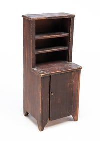MINIATURE AMERICAN BROWN-PAINTED PINE STEPBACK CUPBOARD.