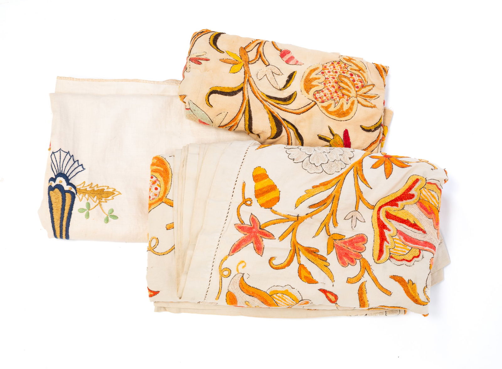 THREE AMERICAN EMBROIDERED TEXTILES.: 19th-20th Century. Crewelwork panel on linen in bold floral and insect design, 70"l. 34"w. Two-piece crewelwork linen bedspread on linen in bold floral design, 100"l. 86"w. Embroidered linen panel dep
