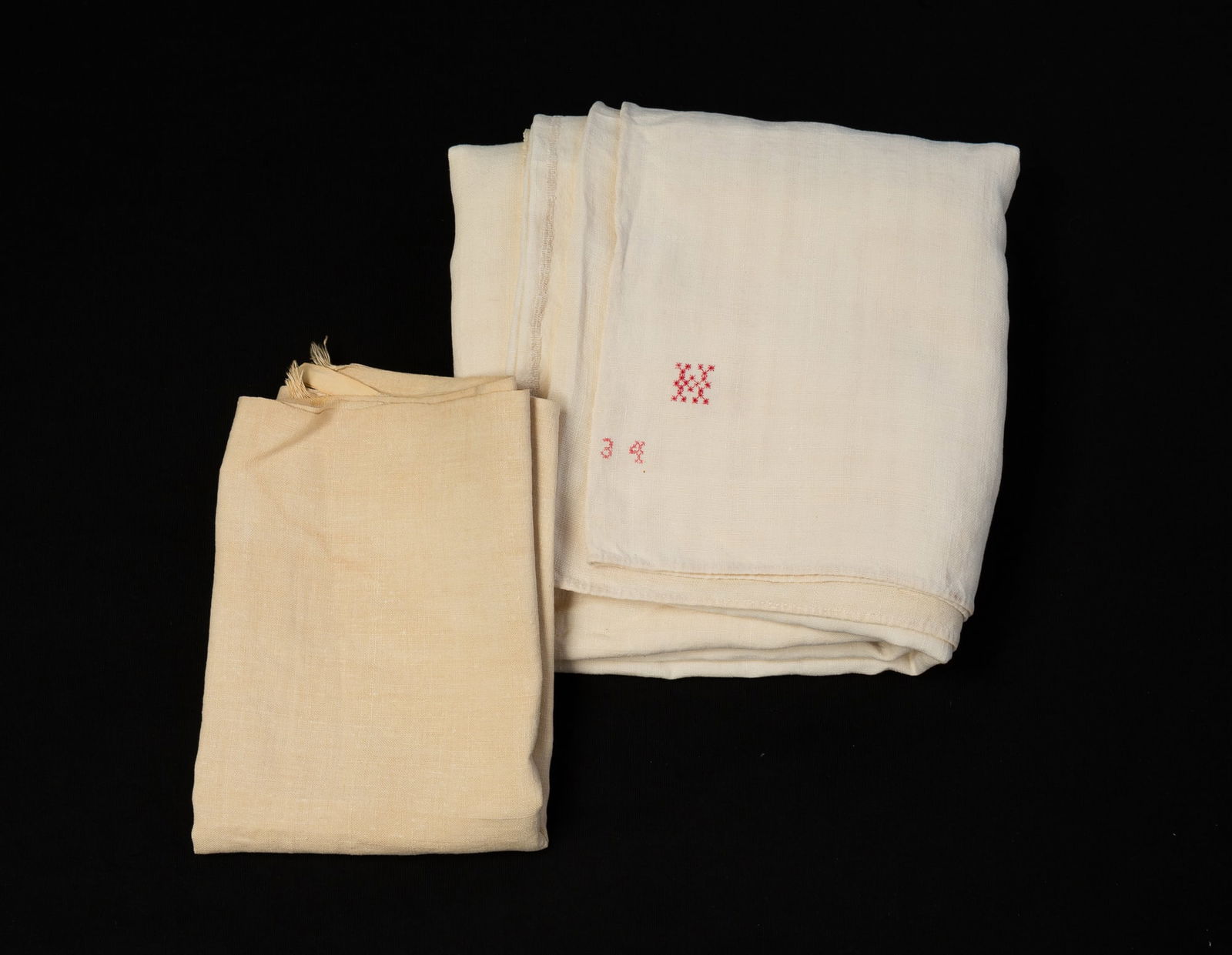 PENNSYLVANIA LINEN SHOW TOWEL AND MONOGRAMMED LINEN SHEET.: American, mid-19th Century. Linen show towel stitched with roosters, an eight-pointed star, the initials "BF," and the date 1872, with two hangers at top and fringed bottom. 56"l. 19"w. Two-piece hand