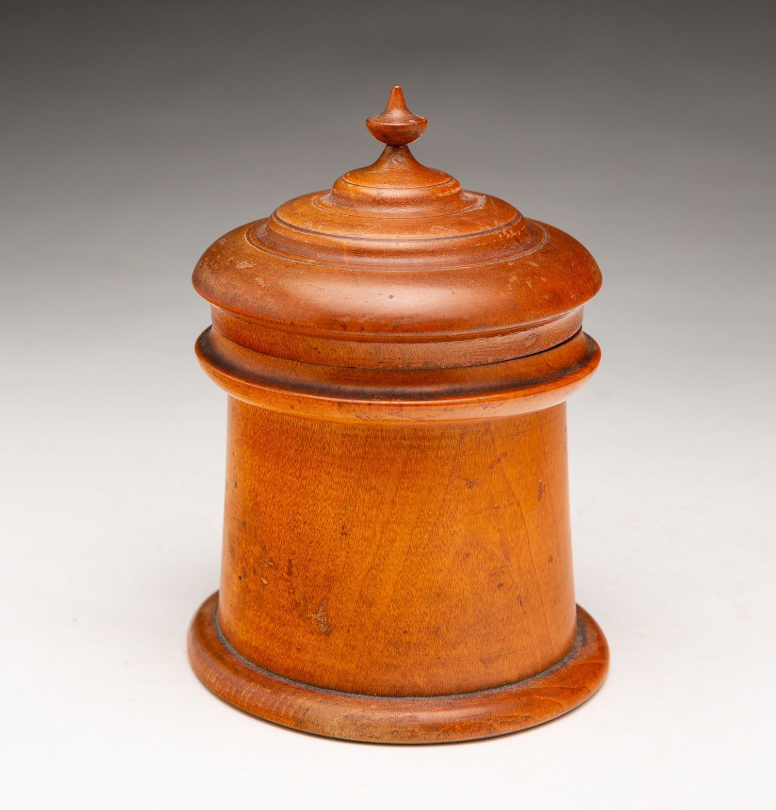 PEASEWARE LIGHTHOUSE JAR.: Ohio, Mid-19th Century. Lighthouse form jar with round bottom, banded lid with an urn finial. 5.725"h.Provenance: From the Lifetime Collection of Ronald & Kathy Wright (Willoughby, Ohio). PLEASE TAKE