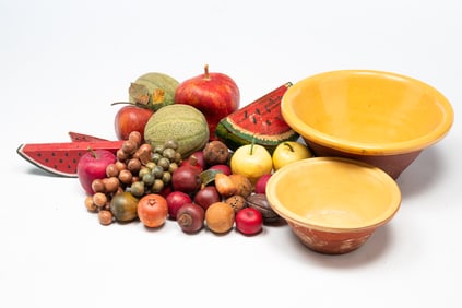 TWO AMERICAN GLAZED REDWARE BOWLS FILLED WITH FAUX FRUIT, INCL. S.D. MEADOWS (PALESTINE, ILLINOIS).