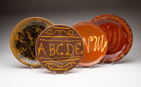 FOUR AMERICAN GLAZED REDWARE PLATES, INCL. TURTLECREEK POTTERY (MORROW, OHIO).