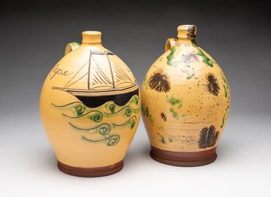 TWO WISCONSIN POTTERY (COLUMBUS, WISCONSIN) GLAZED REDWARE JUGS.