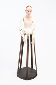 EUROPEAN CARVED, POLYCHROMED, AND ARTICULATED CAGE DOLL.