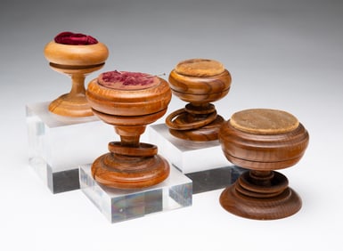 FOUR AMERICAN PEASEWARE PIN CUSHIONS.