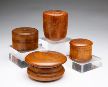 FOUR DIMINUTIVE AMERICAN TREENWARE LIDDED JARS.