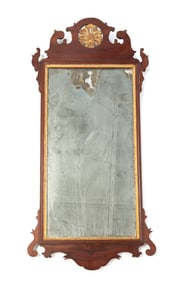 GEORGE III MAHOGANY AND PARCEL-GILT MIRROR.