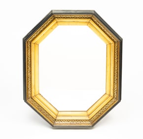 VICTORIAN EBONIZED AND PARCEL-GILT MIRROR.