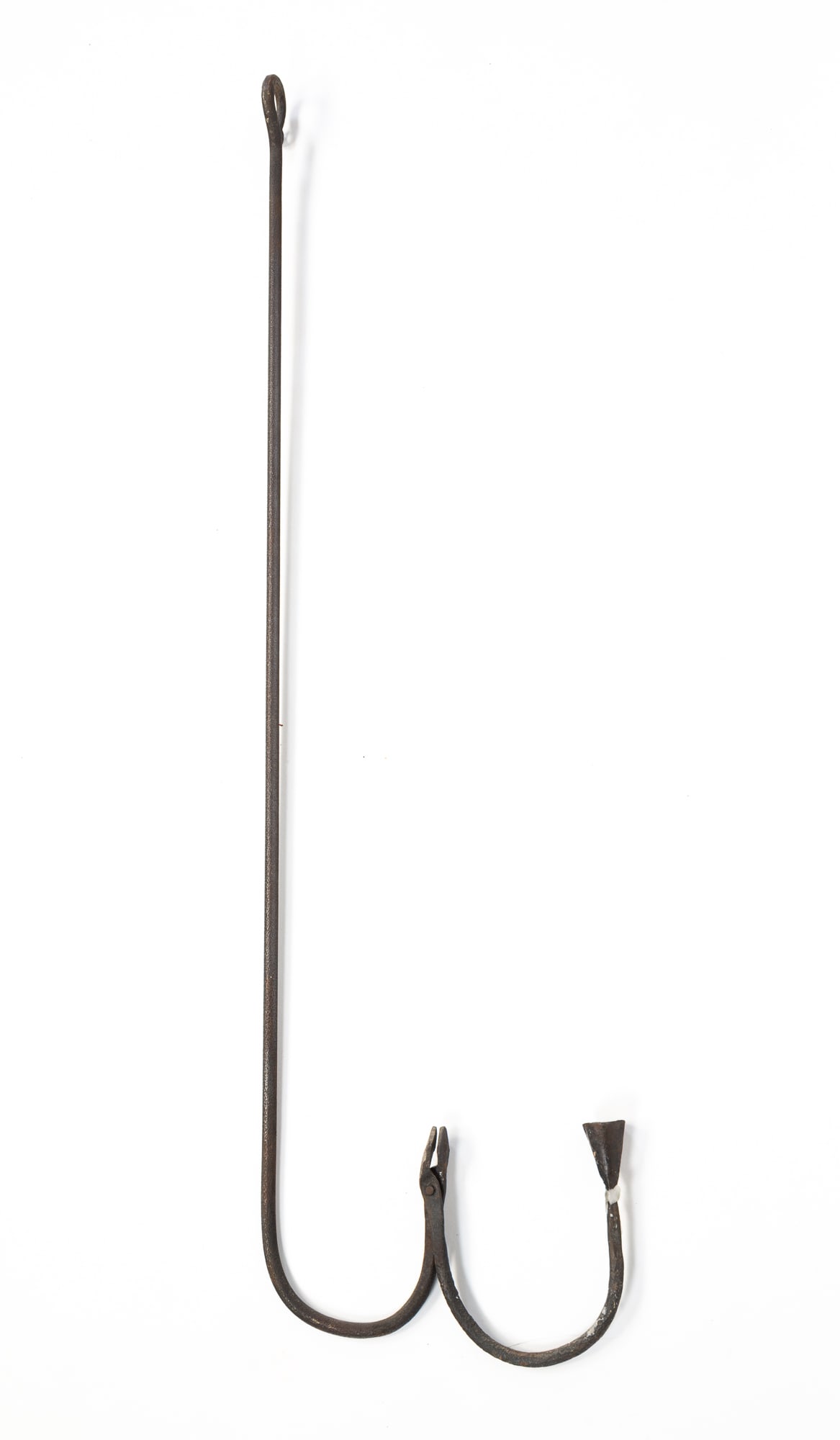 AMERICAN HANGING WROUGHT IRON RUSH LIGHT AND CANDLE HOLDER.: 18th Century. Straight standard with hanging hook at top and U-shape at end, another U-shape riveted at end to form a rush light holder with a candle holder at other end. 36"h.Provenance: From the Lif