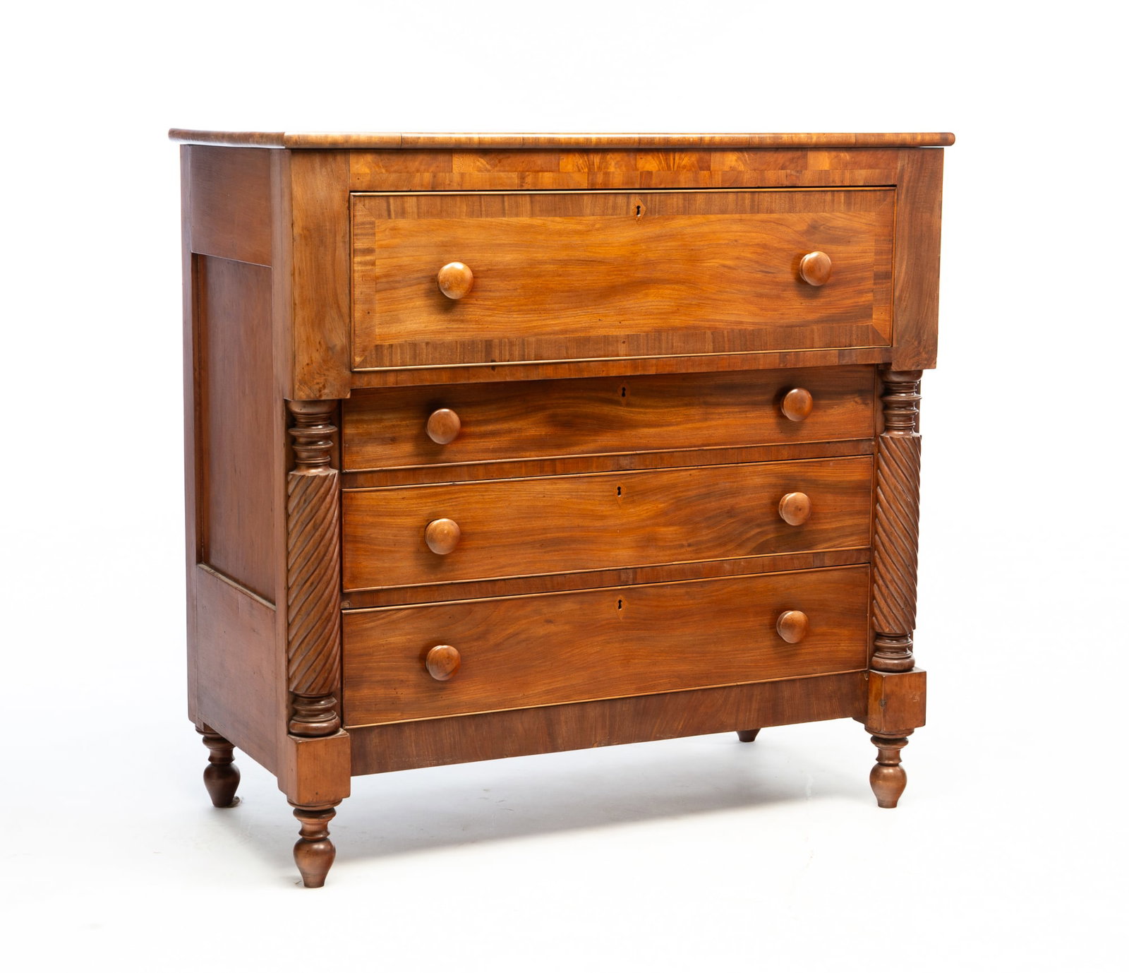 AMERICAN EMPIRE CHERRY AND MAHOGANY FOUR-DRAWER CHEST.: Mid-19th Century. Poplar secondaries. Having a rectangular top above a projecting, deep drawer over three stacked long drawers flanked by rope-twist pilasters. It rises on turnip feet. 42.75"h. 44"w.