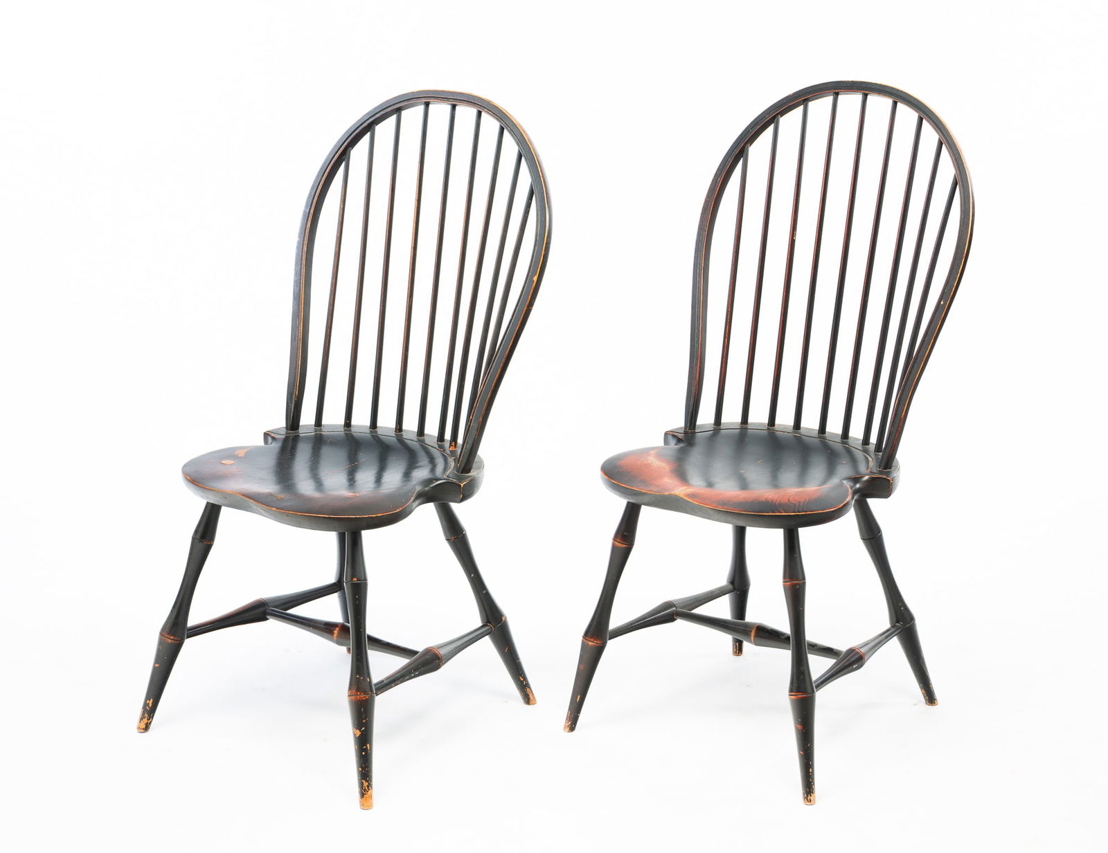 NEAR PAIR OF DAVID T. SMITH & CO. (MORROW, OHIO) COLONIAL STYLE GREEN-PAINTED BOW-BACK WINDSOR SIDE: Late 20th-early 21st Century. Mixed woods. Each having a bowed crest rail above a rod back and a saddle seat. They rise on bamboo-turned legs joined by H-stretchers. The underside of one seat is