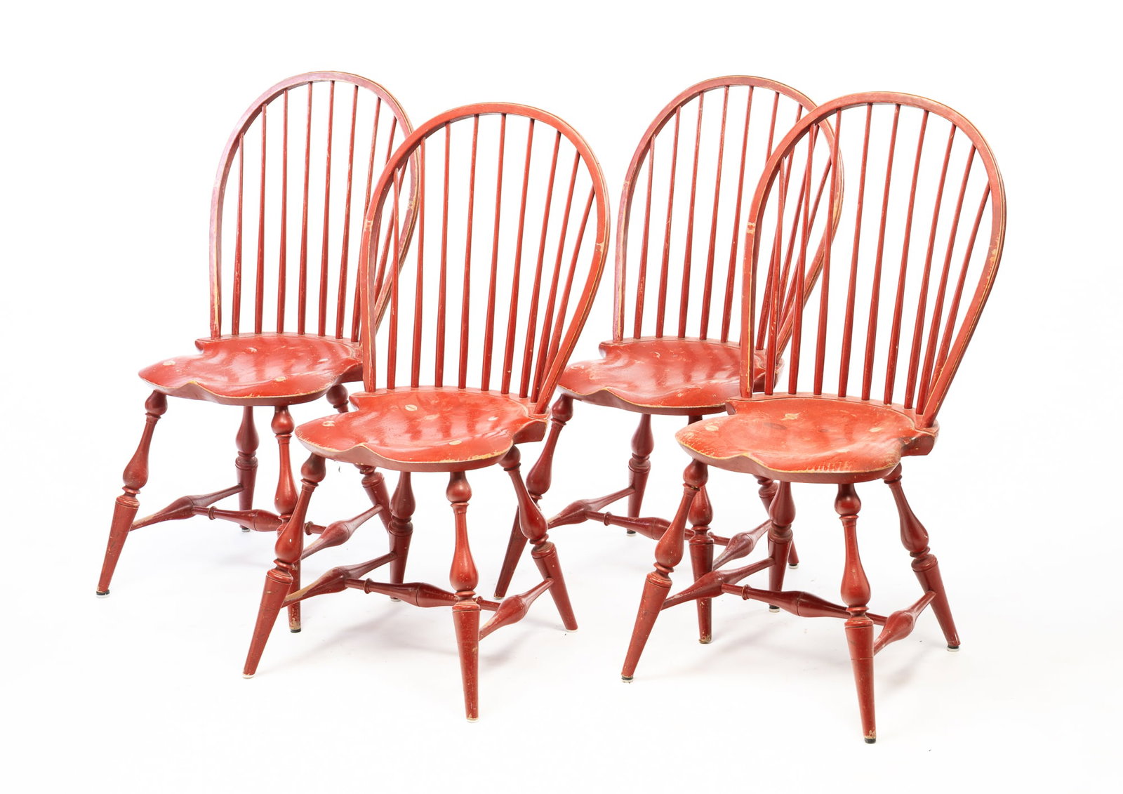 FOUR RIVER BEND CHAIR CO. (LEBANON, OHIO) COLONIAL STYLE RED-PAINTED BOW-BACK WINDSOR SIDE CHAIRS.: Late 20th-early 21st Century. Mixed woods. Each having a bowed crest rail above a rod back and saddle seat. They rise on turned and splayed legs joined by H-stretchers. The undersides of the seats are