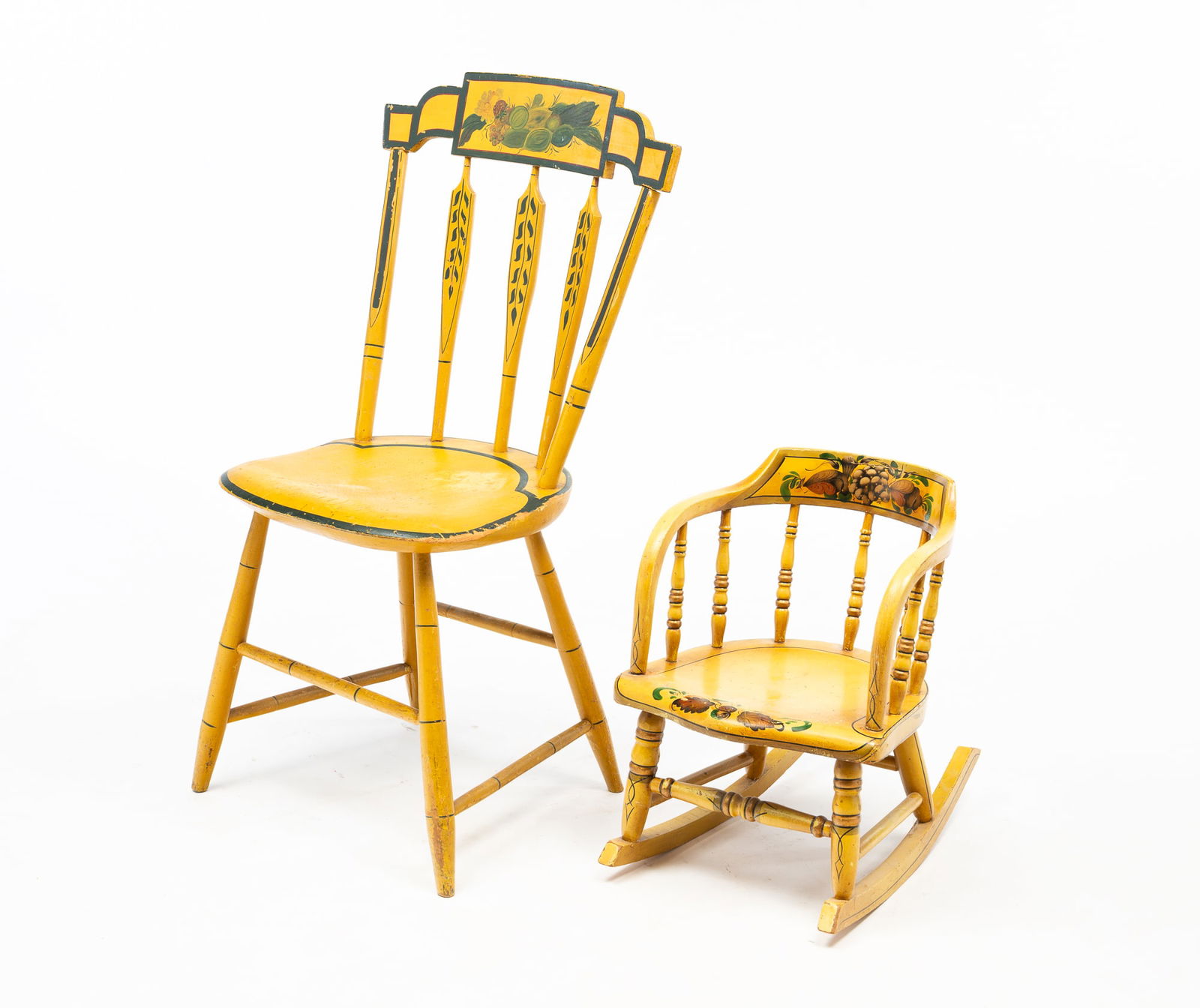TWO AMERICAN PAINT-DECORATED FANCY CHAIRS, INCL. CHILD'S ROCKER SIGNED "JOANN SCHOCK (LANCASTER: 19th Century. Mixed woods. Including a yellow-painted side chair with stepped, fruit and foliate crest rail above arrow-form spindles, a plank seat, and turned legs joined by a box stretcher. The