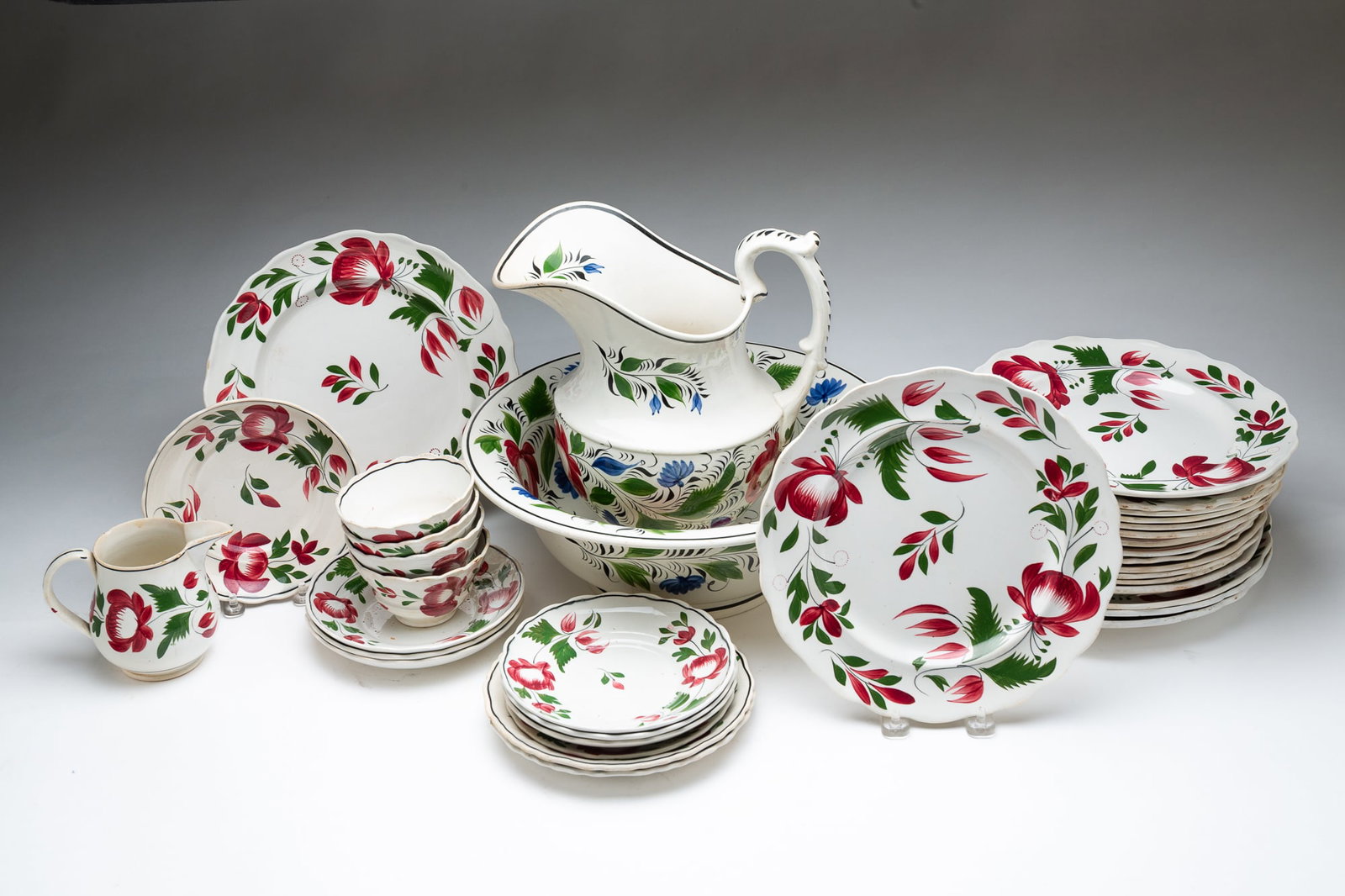 LARGE GROUP OF ADAMS "ROSE" IRONSTONE.: English, 19th Century. Includes dinner plates, patterns, luncheon plates, cups and saucers, and a large wash basin pitcher and bowl. Approximately 35 pieces.Provenance: From the Lifetime Collection