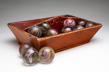 TWENTY-SIX AMERICAN HAND-BLOWN GLASS MARBLES WITH CARRIER.