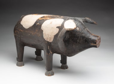 FOLK ART CARVED AND PAINTED PIG.