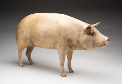 FOLKSY CARVED AND PAINTED PIG.