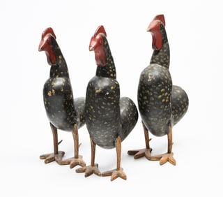 THREE FOLKSY CARVED AND PAINT-DECORATED WOOD ROOSTERS.