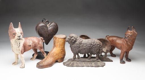 SIX AMERICAN CAST IRON ITEMS, INCL. DOORSTOPS.