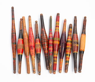 TWELVE INDIAN POLYCHROMED HARDWOOD CHAPATI ROLLING PINS.