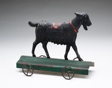 RARE PRESSED TIN GOAT PULL TOY.