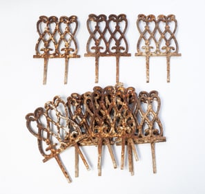 TEN SECTIONS OF CAST IRON GARDEN EDGING.