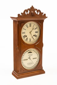ITHACA CALENDAR CLOCK CO. (ITHACA, NEW YORK) WALNUT DOUBLE-DIAL MANTEL CLOCK.