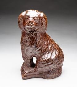 OHIO SEWER TILE SEATED SPANIEL.