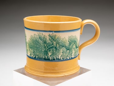 AMERICAN YELLOW WARE MUG WITH MOCHA DECORATION.