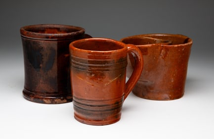 THREE REDWARE MUGS.