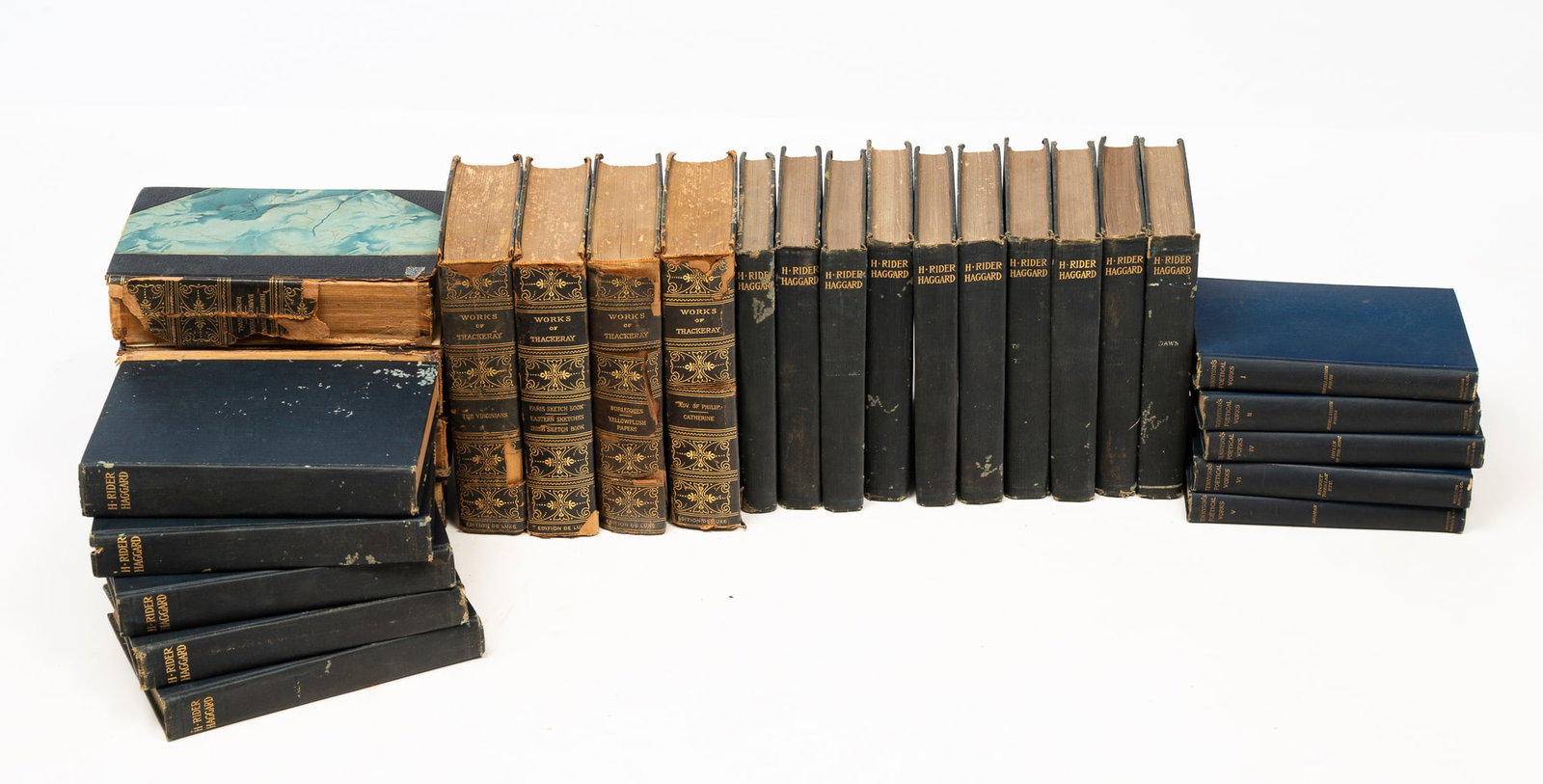 TWENTY-NINE VOLUMES OF WORKS BY H. RIDER HAGGARD, WILLIAM MAKEPEACE THACKERAY, AND ALFRED LORD (1 of 5)