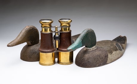 BINOCULARS AND A PAIR OF MALLARD DECOYS.